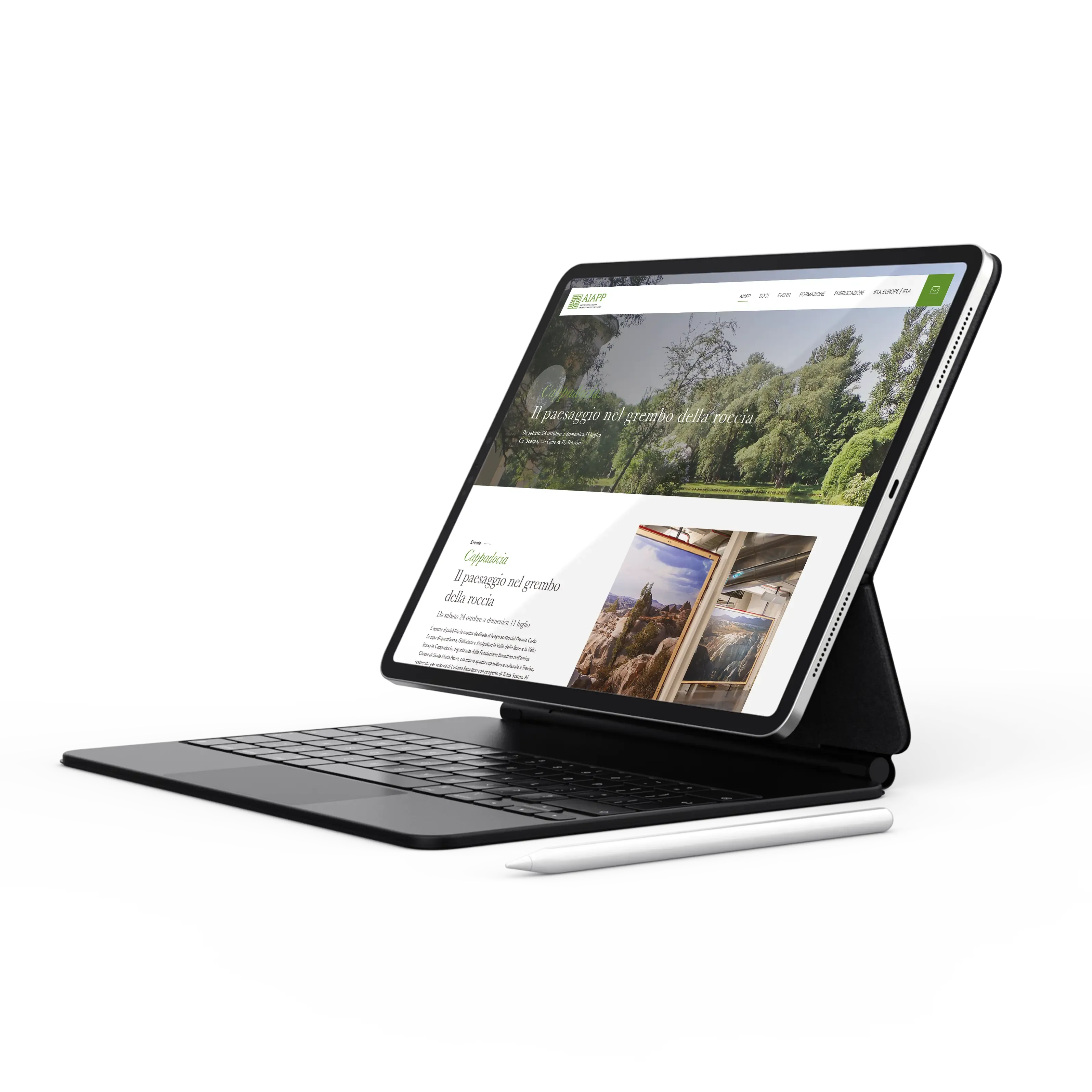 Tablet con tastiera che mostra una pagina web dell'associazione AIAPP dedicata a un articolo sul paesaggio, con immagini di scenari naturali e testi descrittivi.